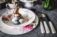 Kaboompics - Round dinner table decorated with easter motifs