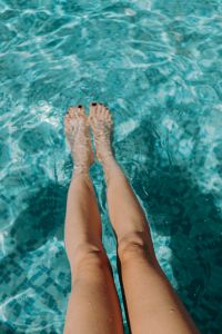 Women's legs in the pool