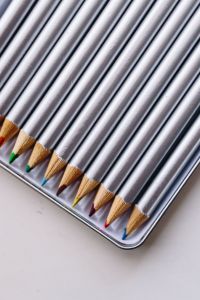 Kaboompics - Silver crayons in a box