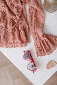 Blouse in pale pink colour made of thin chiffon with frills & heart shaped sunglasses
