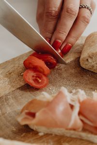 Kaboompics - Woman making bruschetta with healthy ingredients