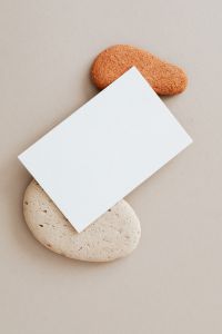 Kaboompics - Blank card & rocks on beige background