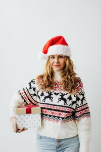 Kaboompics - Woman with Gifts Wearing Christmas Sweater and Santa Hat