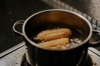 Corncobs cooked in a pot