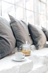 Kaboompics - Morning coffee with a jar of brown sugar with pillows
