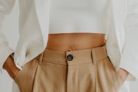 Kaboompics - Minimal fashion - Unrecognizable Woman in beige trousers