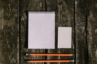 Kaboompics - White notepad with pencils on a wooden background