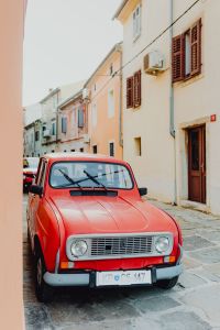 Kaboompics - An old red Renault 4 car parked on the street in Izola, Slovenia