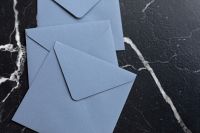 Kaboompics - Blue envelopes on marble