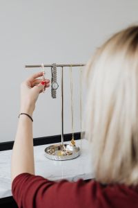 Kaboompics - Jewellery stand on marble & woman