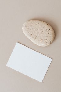 Kaboompics - Blank card & rock on beige background
