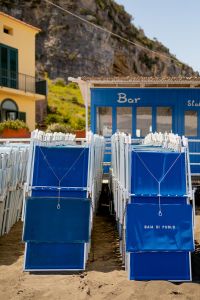 Kaboompics - Blue hotel loungers on the beach, Baia di Puolo Hotel