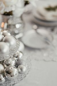Silver balls on a glass stand on the table