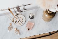 Jewellery Stand on a Marble Table, White Background, pink perfumes