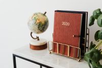 Planner on The White Marble Table, White Background, Pilea, Globe