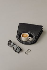 Kaboompics - Minimalist Fashion Accessories – Black Bag and Sunglasses - Coffee - Jewelry