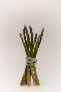 Kaboompics - Green Asparagus Tied With a Silver Bracelet