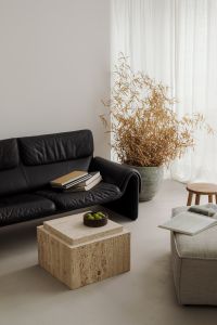 Black Leather Sofa with Travertine Coffee Table - Japandi Living Room