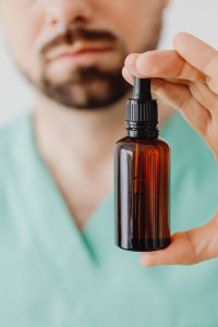 Doctor with a bottle of essential oil