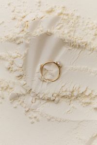 Kaboompics - Jewellery Display: Golden Ring on Flour Canvas