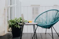 Kaboompics - A stylish garden chair and a small table on the balcony