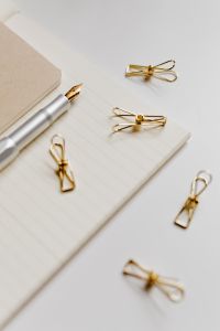 Kaboompics - Fountain pen, clips and notebooks on a white desk