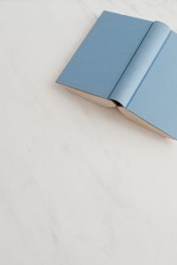 Kaboompics - Blue open book on marble table