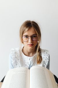 Kaboompics - Young Woman Studying with Open Books
