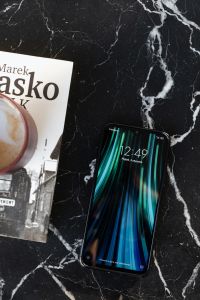 Kaboompics - Coffee Mobile Phone and book on table