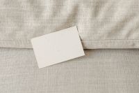 Kaboompics - Angled Blank Business Card Mockup on Textured Beige Linen