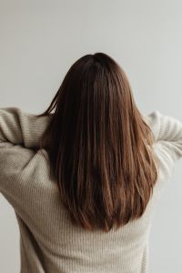 Medium-Length Brown Hair Portraits of a Young Woman in a Neutral Setting