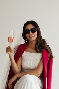 Kaboompics - Hen Party Toast With a Pink Blazer Over a Wedding Dress