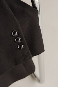 Kaboompics - Black Blazer Buttons against Chrome Chair