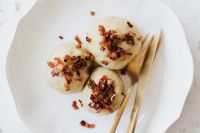 Kaboompics - Traditional Polish Potato Dumplings with Meat and Gold Cutlery
