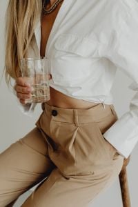 Minimal Fashion - Faceless Aesthetic - Unrecognizable Woman in beige trousers