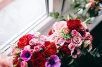Kaboompics - Two Colorful Flower Bouquets by a Window with Roses and Purple Anemones