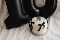 Kaboompics - Black Number Balloons and Cake on White Bedding