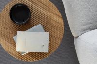 Kaboompics - Wide Overhead View of Oak Side Table with Books and Black Cup