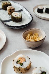 Kaboompics - Maki and Nigiri Sushi Assortment Across Ceramic Serving Plates
