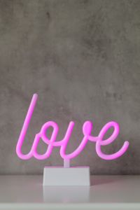 Kaboompics - Wide Pink Neon Love Sign on Gray Concrete