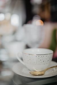 Kaboompics - Cup and gold tea spoon