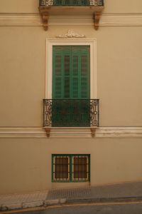 Kaboompics - Green Shutters and Iron Balcony in Malaga