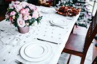 Kaboompics - White Place Settings and Pink Flowers on a Festive Table