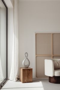 Kaboompics - Textured Loop Sculpture beside Upholstered Armchair in Neutral Room