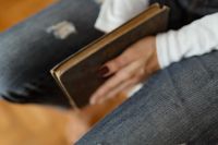 Kaboompics - Beautiful young woman reading a book