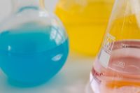 Kaboompics - Close-Up of Colorful Laboratory Flasks on Yellow Background