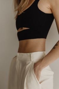 Kaboompics - Casual Minimalist Outfit with Black Crop Top and White Joggers