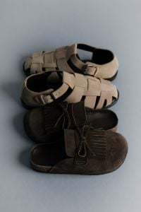 Kaboompics - Vertical Stack of Neutral Suede Shoes and Woven Sandals