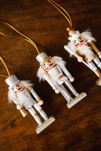 Kaboompics - Hanging Nutcracker Ornaments on a Wooden Background