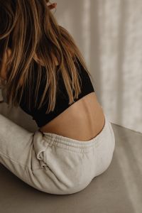 Kaboompics - Casual Neutral Outfit with Black Crop Top and White Joggers